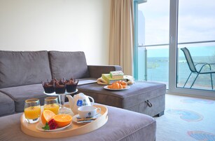 Comfort Apartment, Balcony, Sea View | Living area | 40-inch LED TV with satellite channels, TV, heated floors