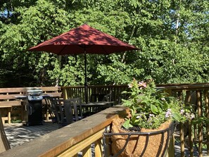 Outdoor dining - Light-Filled Log Home, 4 Wooded Acres, & Lake Access.  The water is 0.4 mi away. (Fayette)