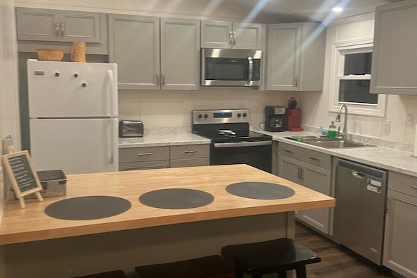 Beautiful kitchen stocked with all the gadgets and kitchenware you need