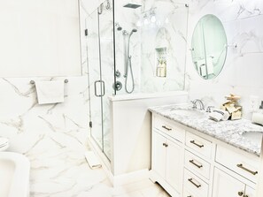 Combined shower/tub, hair dryer, towels, soap