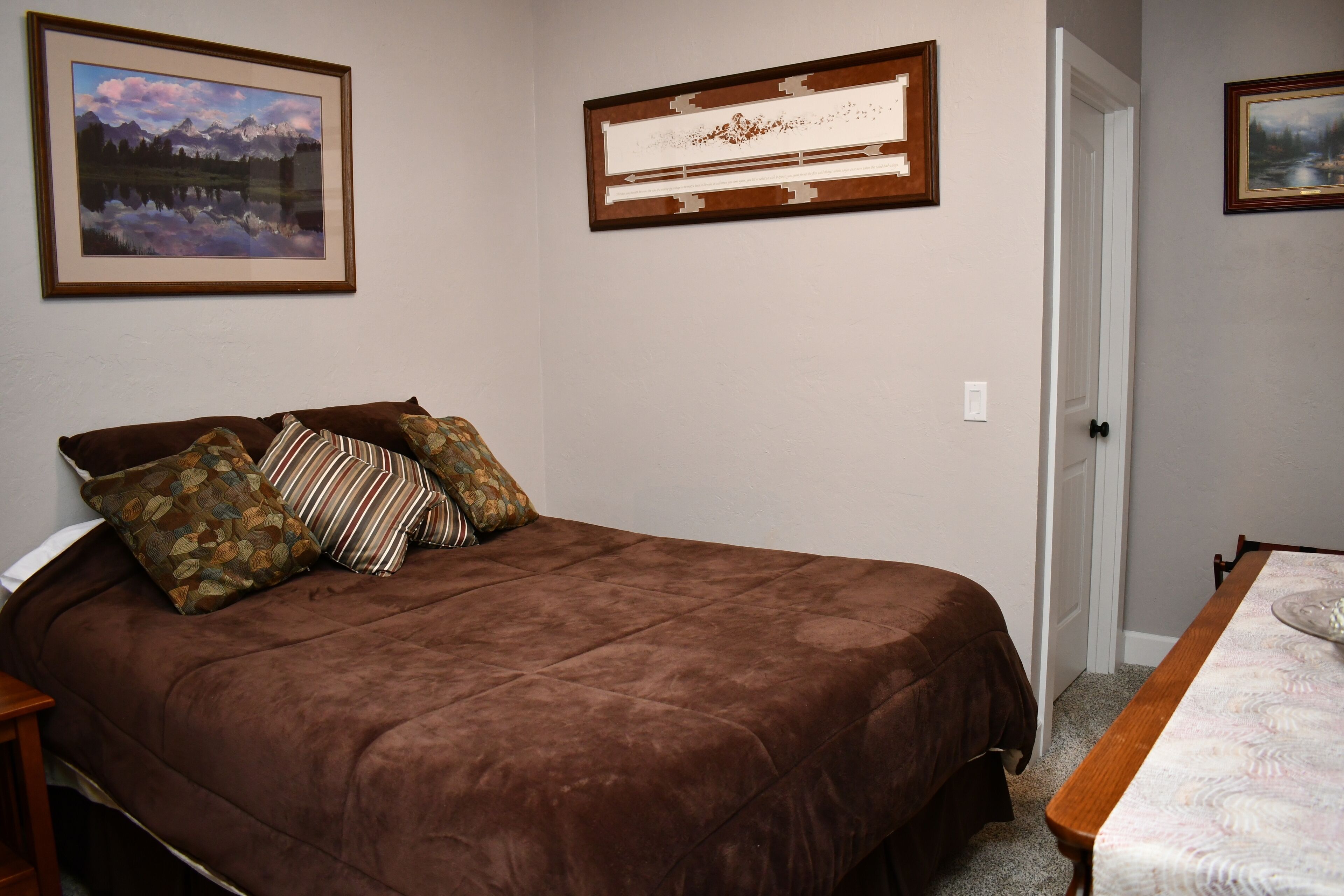 Queen size bed, dresser and closet.