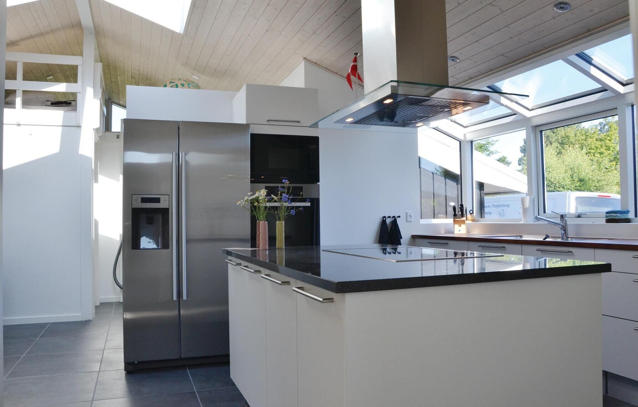 Fridge, stovetop, dishwasher, coffee/tea maker