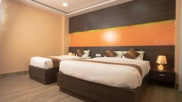 Kamar Triple Deluks | Seprai premium, tempat tidur Select Comfort, dan minibar