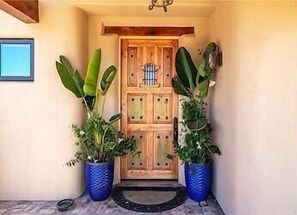 Welcoming front entry with handcrafted wood doors. - Private Pool + Hot Tub | Game Room + Firepit Patio | Renata's Retreat (Templeton)
