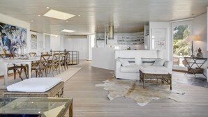 A spacious living area with a dining table, white sofas, and a large rug. - 6 bedroom gorgeous home in Gilleleje (Gilleleje)
