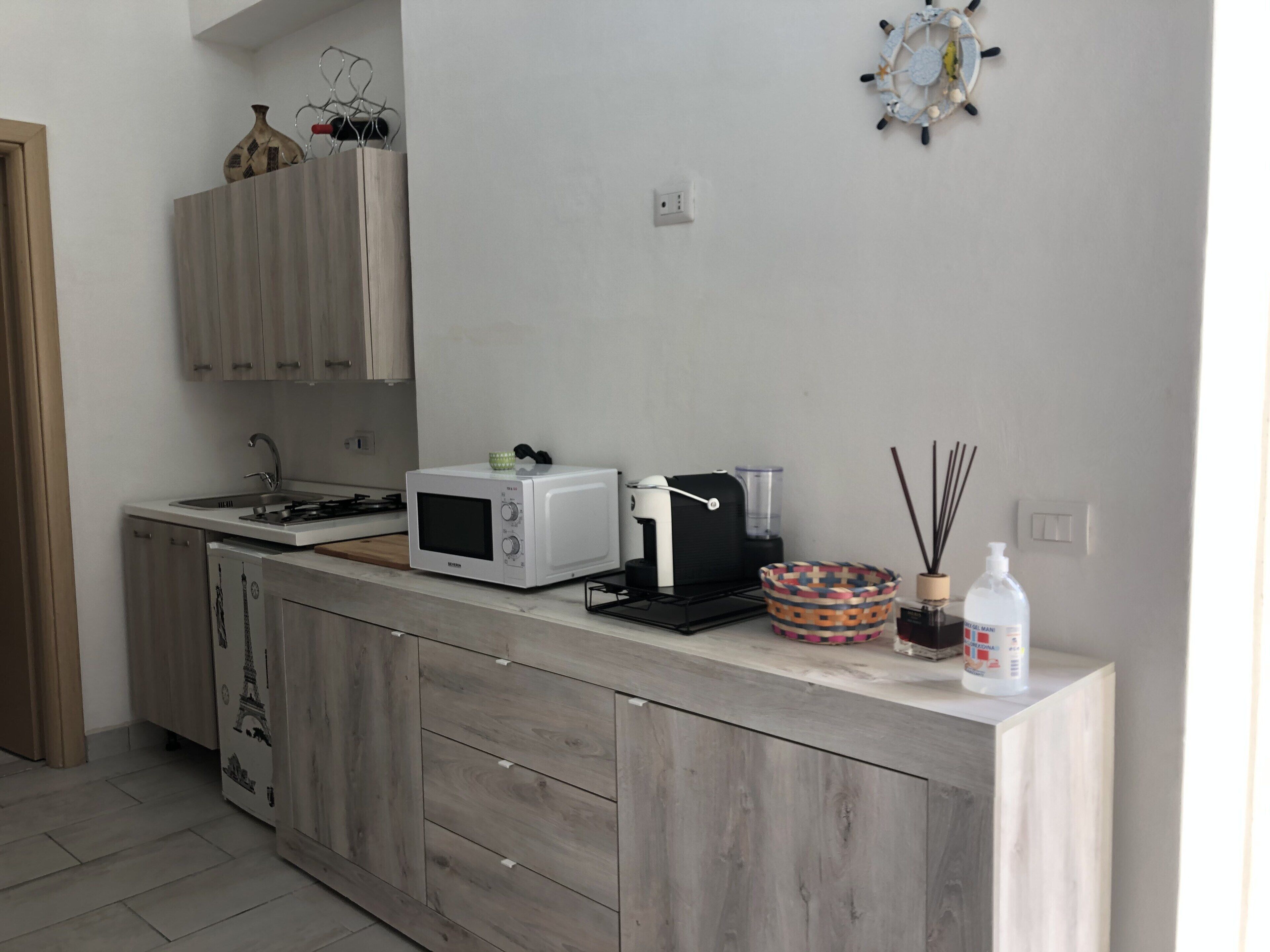 Fridge, microwave, stovetop, coffee/tea maker