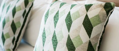 A close-up of two pillows with a diamond pattern.