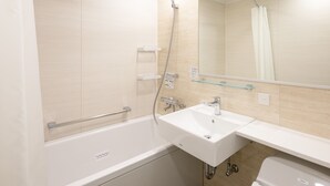 A modern bathroom with a bathtub, a sink, and a shower. - Comfort Hotel ERA Nagoya Meiekiminami (Nagoya)