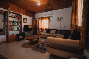 Family House | Living room | 32-inch LED TV with satellite channels, TV - Amazing Bedouin Hospitality (Abu Basma)