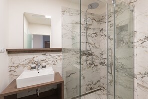 Deluxe Apartment, 1 Bedroom, Kitchen (2) | Bathroom | Shower, rainfall showerhead, hair dryer, towels