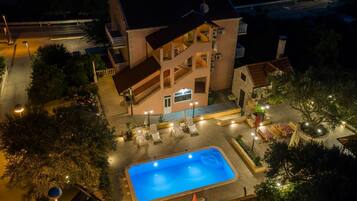 Seasonal outdoor pool, pool umbrellas, pool loungers
