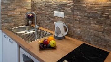 Studio (Standard Studio with Balcony/Sea View) | Private kitchenette | Fridge, microwave, stovetop, coffee/tea maker