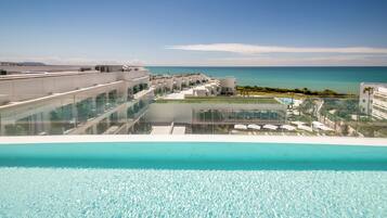 3 outdoor pools, pool umbrellas, sun loungers