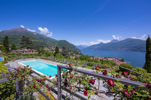 A pool with a view of a lake and mountains. - Penthouse-LakeView-AC-PrivateGarden (Menaggio)