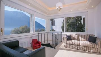 Family Villa, Multiple Bedrooms, Lakeside (Villa Lugano Lakefront) | Living area | Flat-screen TV, fireplace