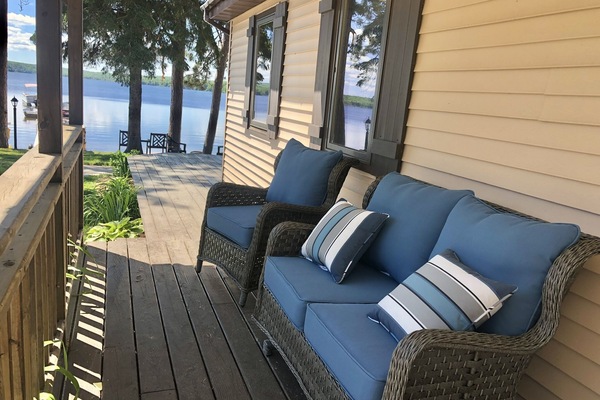 One of two outdoor sitting areas. Under a covered porch