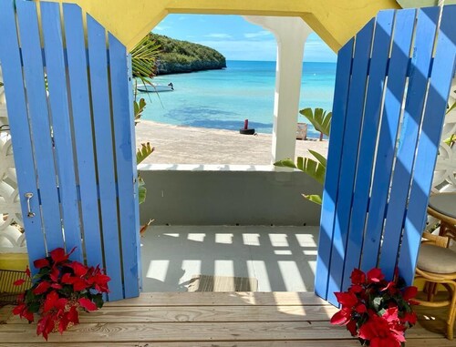 Home overlooking Gregory Town's famous Cove.  Beach chairs and SUP included