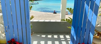 Home overlooking Gregory Town's famous Cove.  Beach chairs and SUP included