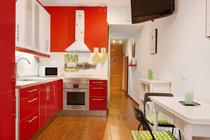 Fridge, microwave, stovetop, coffee/tea maker