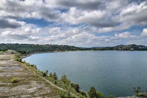 A large body of water surrounded by hills and sparse vegetation. - Pet-Friendly Canyon Lake Studio: Fish, Boat, Relax (Canyon Lake)