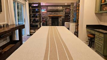 A room with a long table, a fireplace, bookshelves, and a sign reading 'SNOHOMISH, WA'.