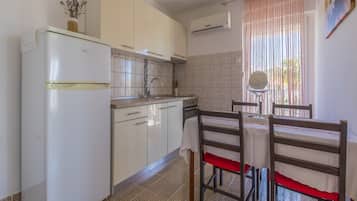 Villa | Private kitchen | Fridge, microwave, oven, stovetop