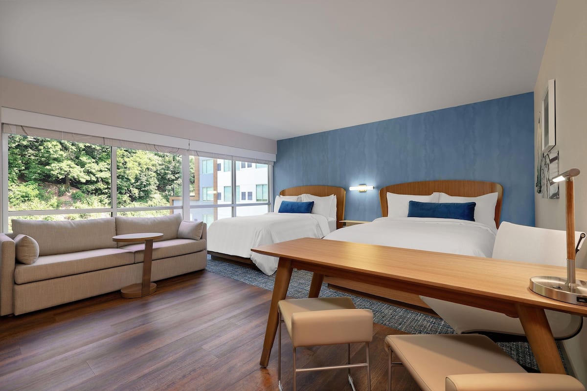 Premium bedding, down duvets, pillow-top beds, in-room safe