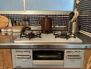 Fridge, microwave, stovetop, cookware/dishes/utensils