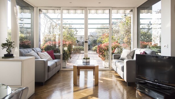 A modern living room with a sofa, a coffee table, and a TV. - The Traveller's Terrace (Milan)