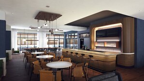 A modern restaurant with a bar area, round tables, and chairs. - Courtyard by Marriott Hamilton (Robbinsville)