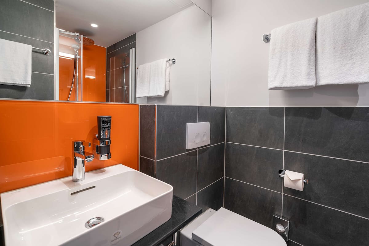 shower, eco-friendly toiletries, hair dryer, towels