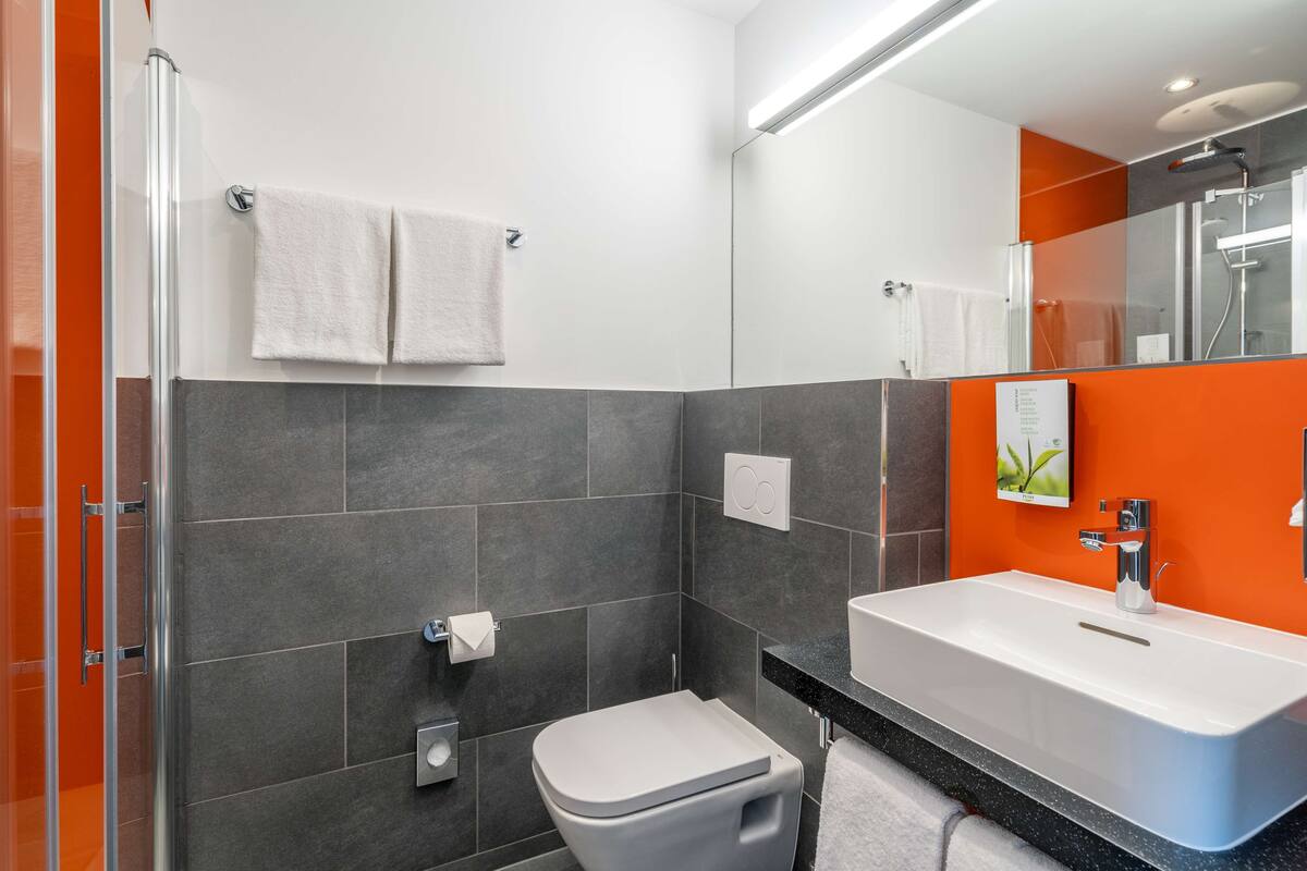 shower, eco-friendly toiletries, hair dryer, towels