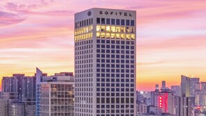 A high-rise building with the name "SOFITEL" prominently displayed at the top.