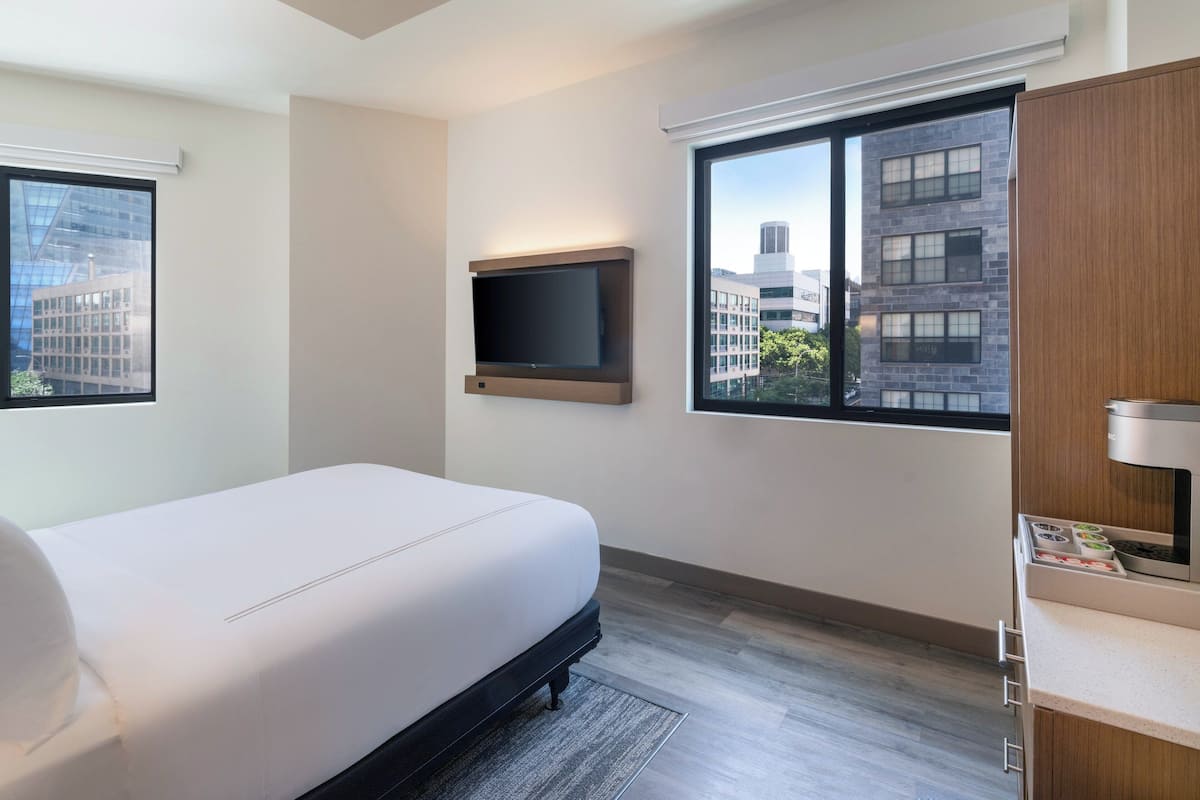 Premium bedding, memory foam beds, in-room safe, laptop workspace