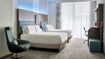 Premium bedding, memory-foam beds, in-room safe, laptop workspace