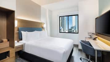 Premium bedding, memory-foam beds, in-room safe, laptop workspace