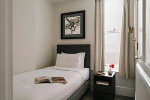 Room, 1 Single Bed | 1 bedroom, individually furnished, iron/ironing board