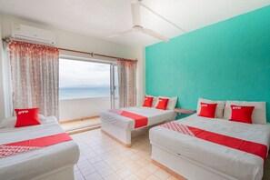 Habitación familiar, para no fumadores, vista al océano | Cortinas blackout, wifi gratis y ropa de cama