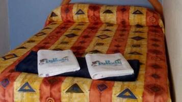 Family Triple Room | Desk, bed sheets