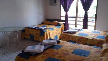 Family Triple Room | Desk, bed sheets