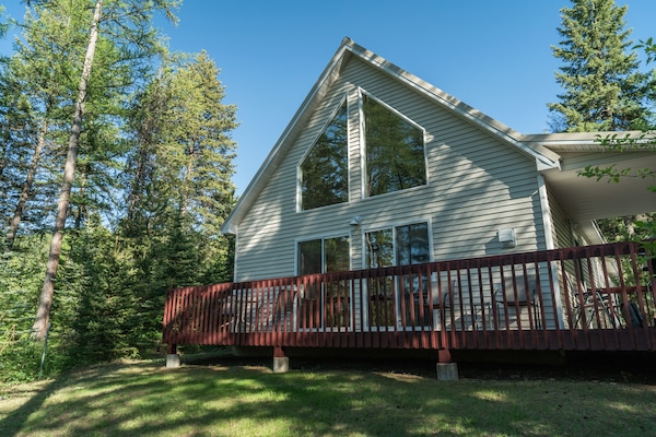 House and deck facing West Glacier Entrance.  Newly stained deck 2020