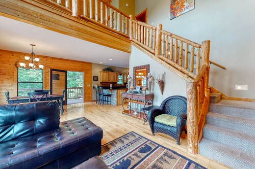 Dog-friendly mountain cabin with a furnished deck, game room & private hot tub