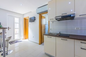 Villa | Private kitchen | Fridge, oven, stovetop, dishwasher