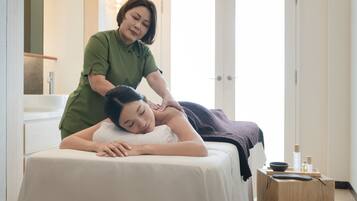 Guests can enjoy a rejuvenating massage in a serene spa setting with a skilled practitioner.