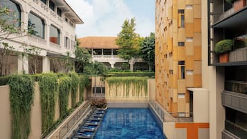 Outdoor pool, open 7:00 AM to 10:00 PM, sun loungers