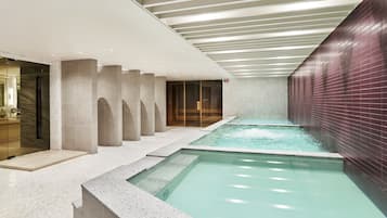 Relax by the serene pool surrounded by spa-like treatment rooms and a calming ambiance.