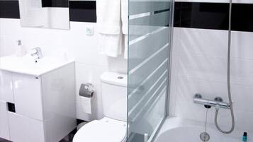 Bathtub, hair dryer, towels