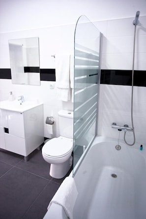 Bathtub, hair dryer, towels