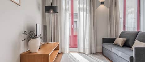 Design Apartment, 1 Queen Bed with Sofa bed, Non Smoking, Balcony | Living area | 40-inch LED TV with cable channels, MP3 dock