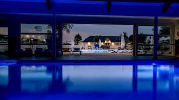 Indoor pool, seasonal outdoor pool, pool umbrellas, pool loungers